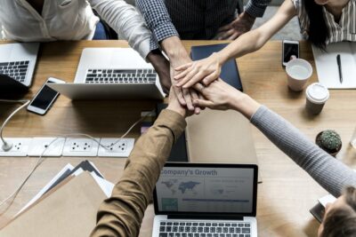 Business people shaking hands together