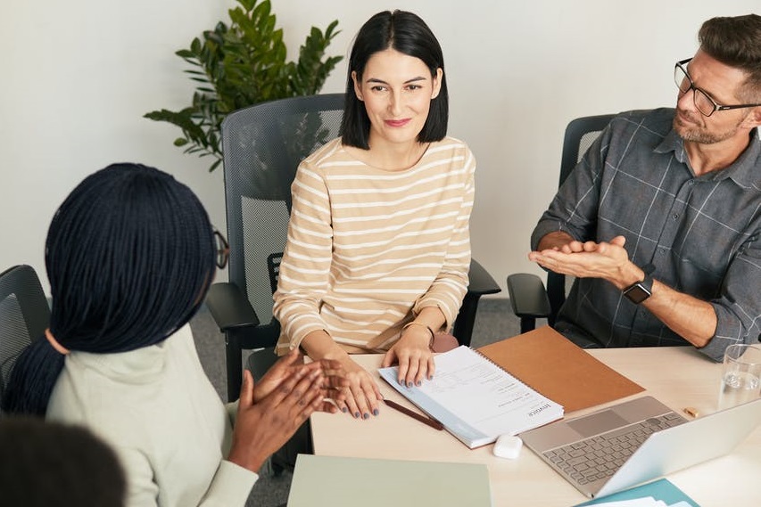 Business people shaking hands together